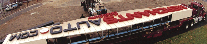 Louis P. Cote, Inc.'s heavy haul truckers deliver the sign for Manchester NH's Fisher Cats baseball stadium